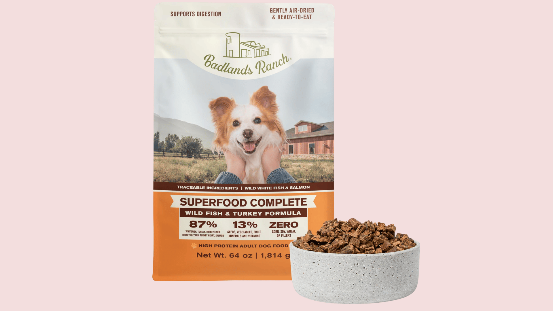 badlands ranch superfood complete dog food bag with a bowl of air dried food on a white background