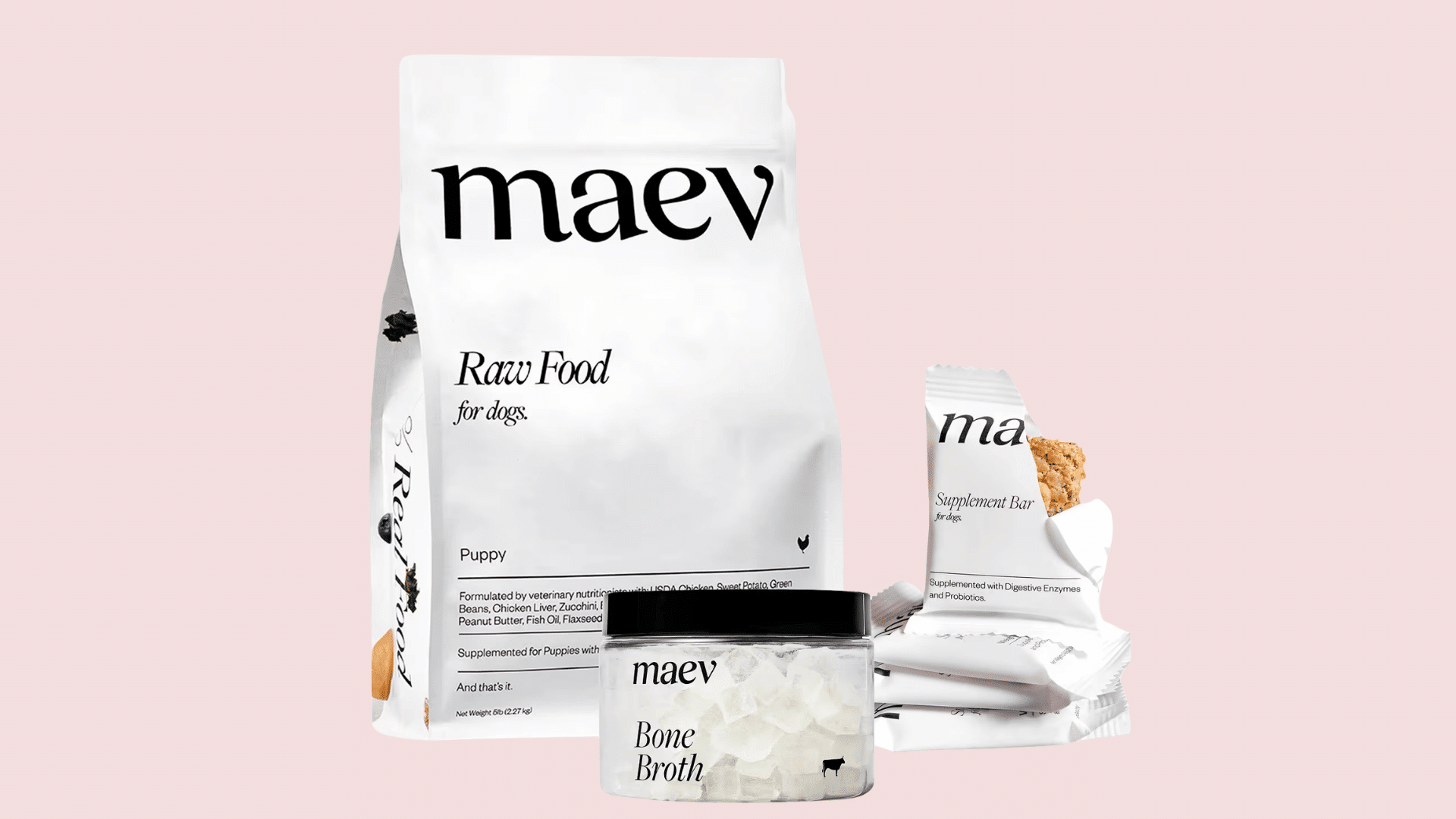 maev raw food for dogs puppy formula package displayed with bone broth container and supplement bars on white background