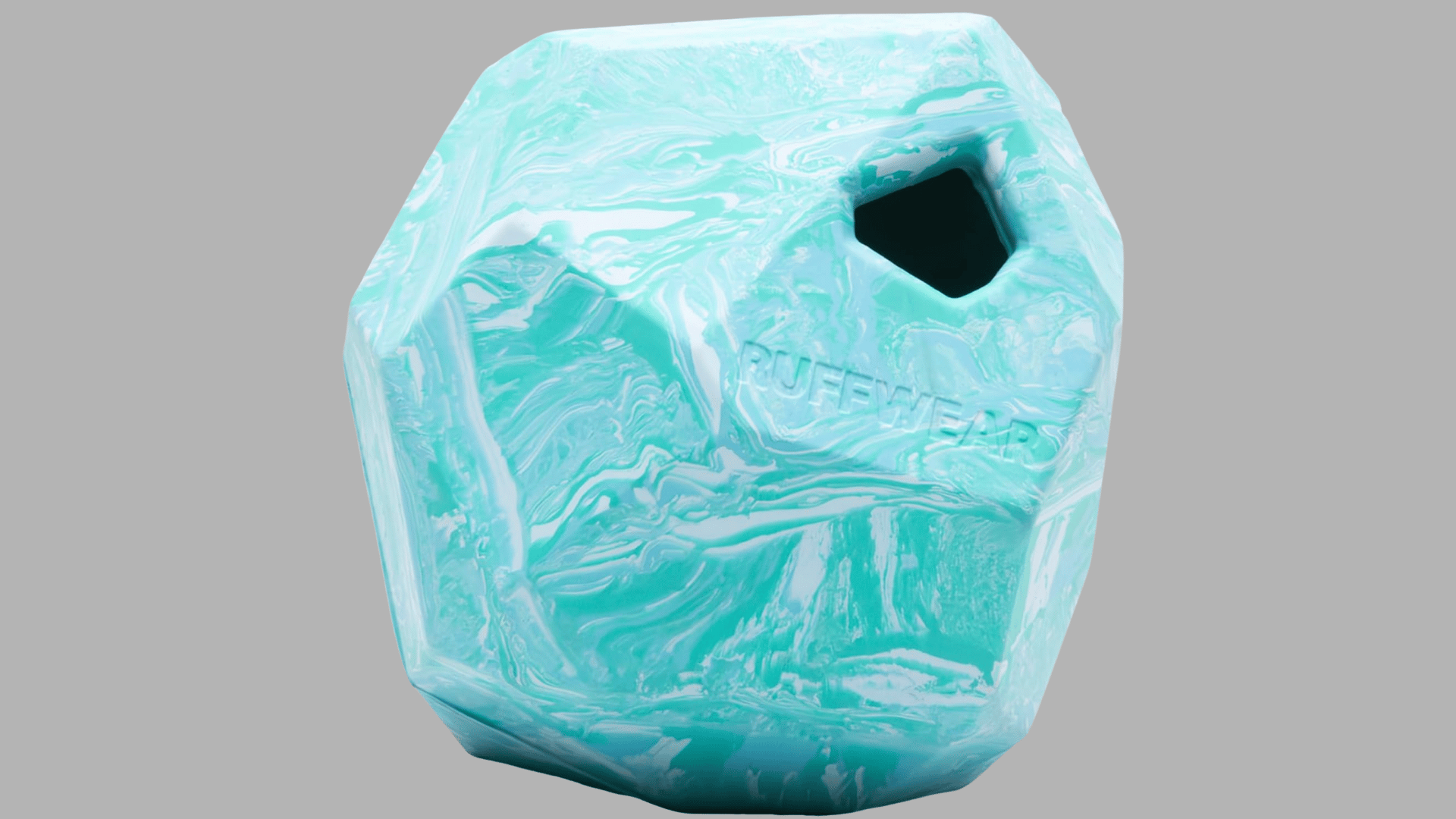 marbled blue and white rubber dog toy shaped like a geometric cube with treat opening on one side displayed on a plain background
