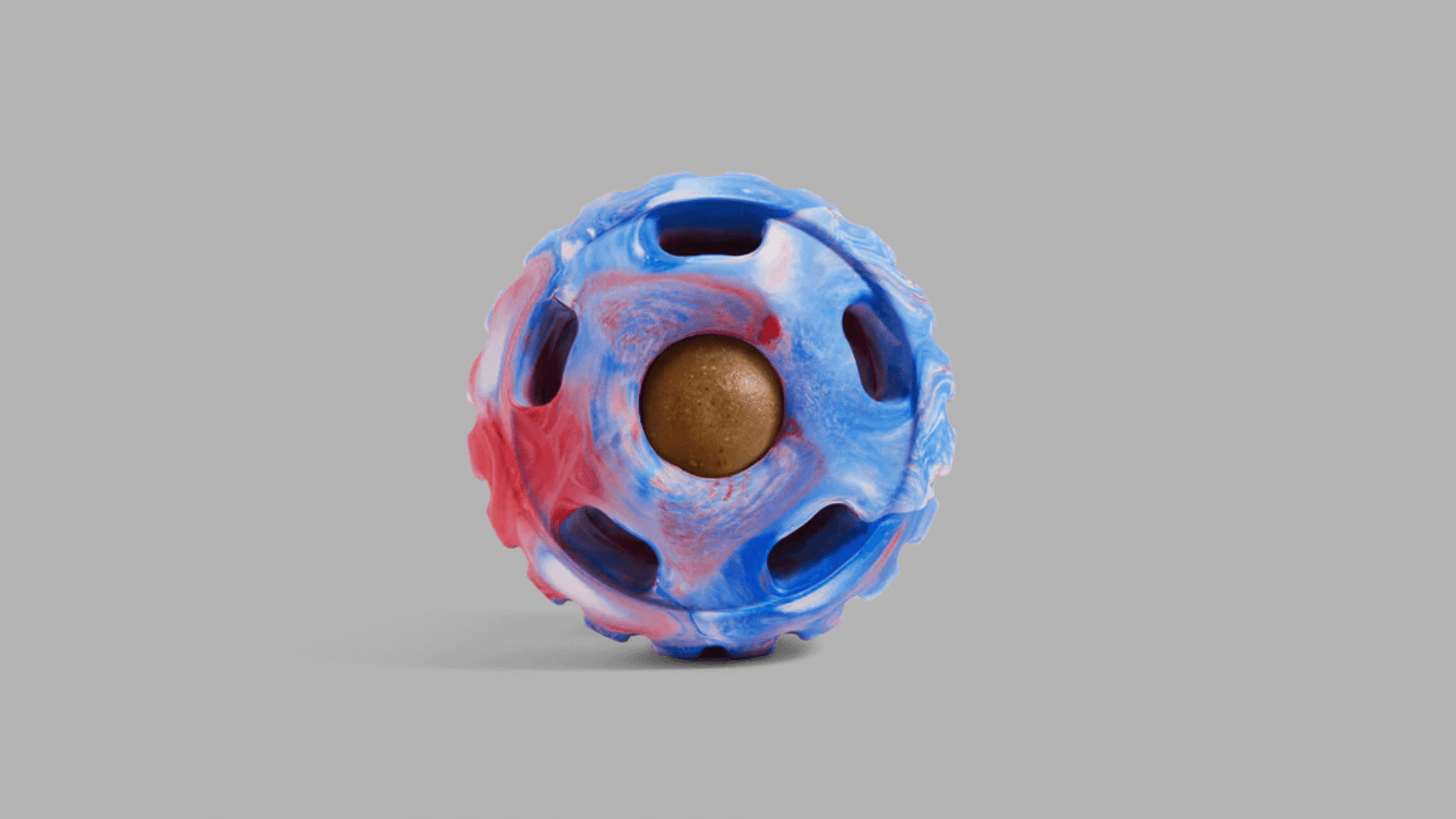 marbled blue red and white rubber treat dispensing dog ball with textured surface and multiple openings around the sides