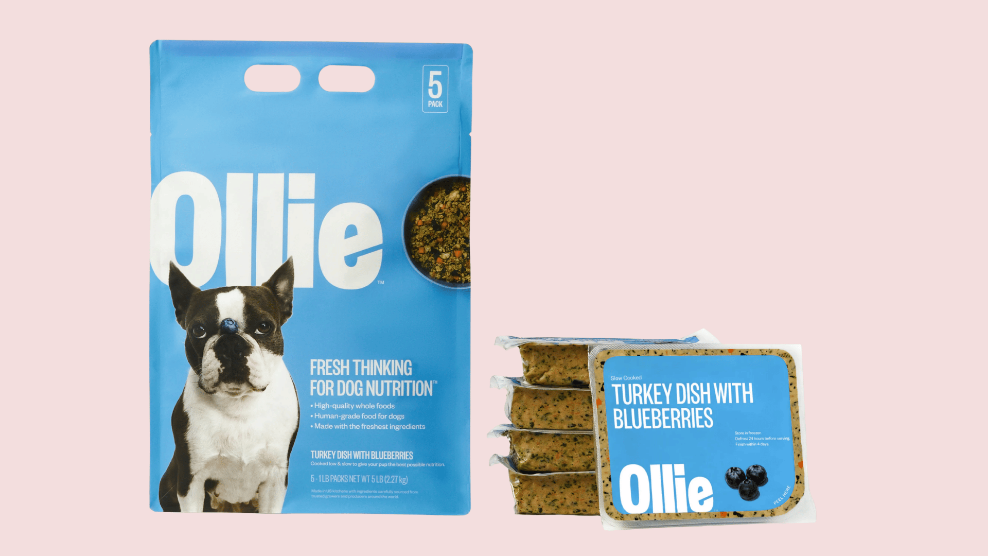 ollie turkey dish with blueberries dog food package displayed beside individual meal packs featuring a dog image on blue packaging