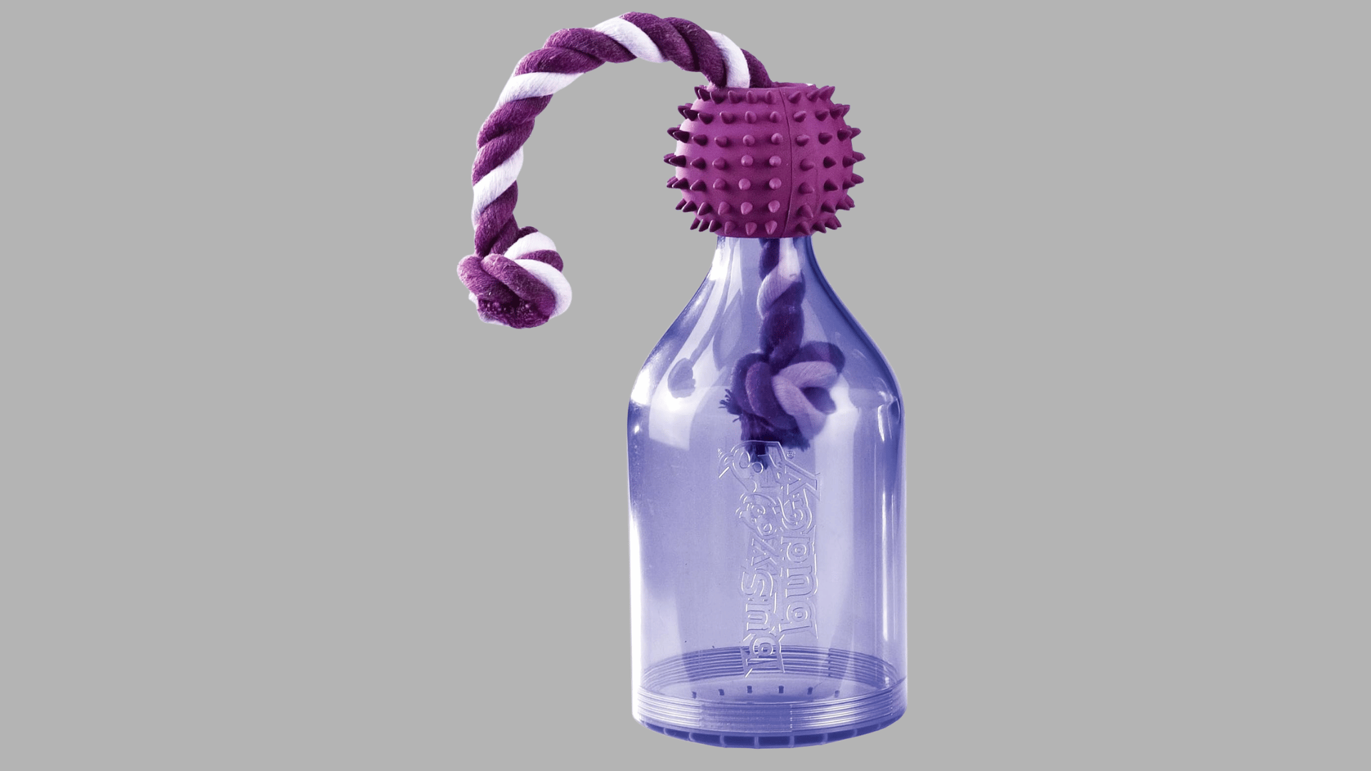 purple treat dispensing dog toy shaped like a bottle with a knotted rope handle and textured rubber ball attached at the top
